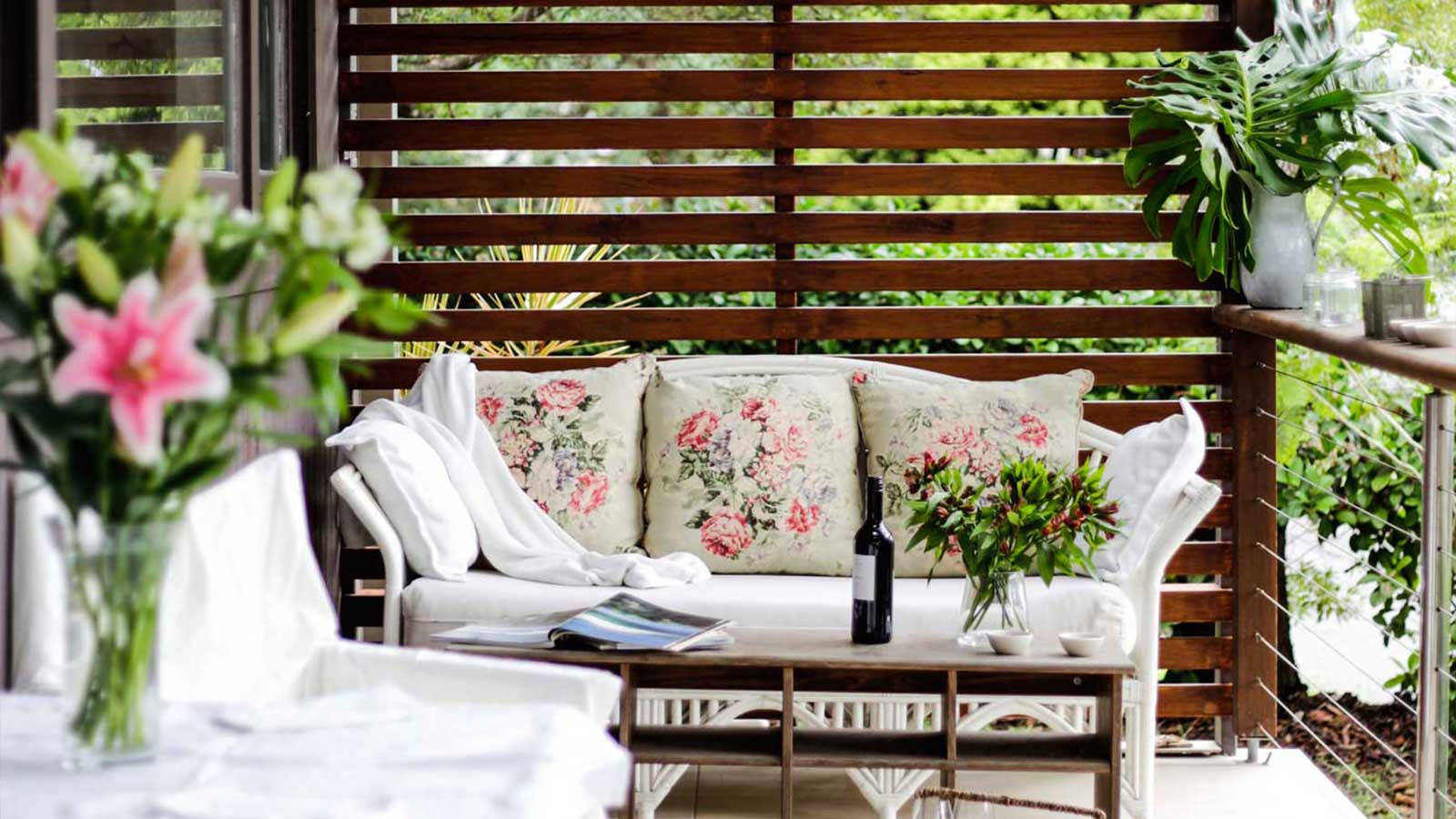 Bateau Bay front verandah after screening, furniture and planting were added