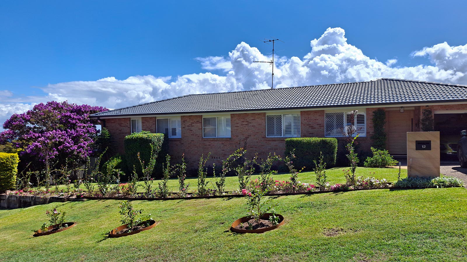 Corlette front garden after the new pathway, planting and sandstone letterbox were added